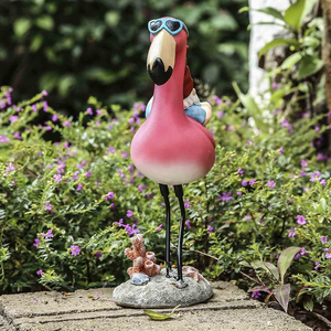 Gnome Reclining on Flamingo Figurines
