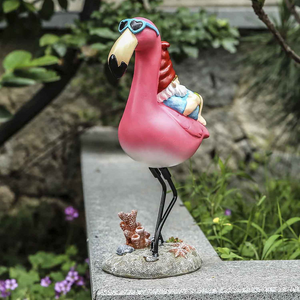 Gnome Reclining on Flamingo Figurines